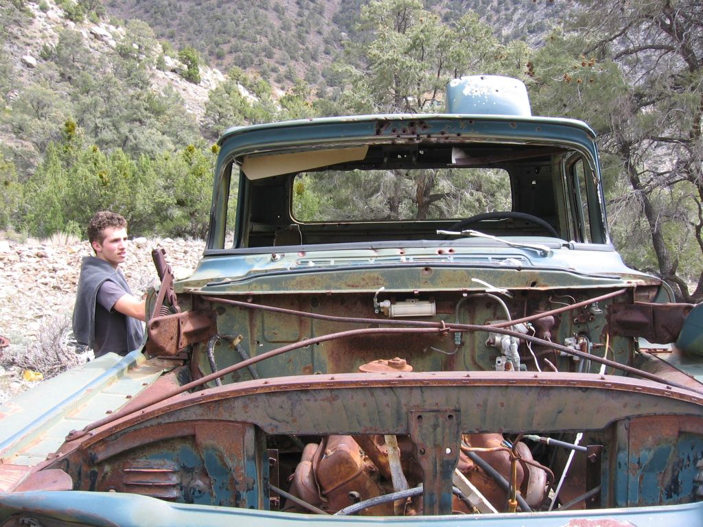 Josh checking out one of the abandoned trucks in Sourdough Canyon: